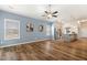 Open-concept living area with hardwood floors flowing into a kitchen with stainless steel appliances at 230 Forest Meadow Ln, Franklinton, NC 27525
