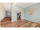 Bright, open-concept living space with hardwood floors, flowing into the kitchen and dining area at 230 Forest Meadow Ln, Franklinton, NC 27525