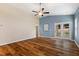 Bright living room featuring hardwood floors, a ceiling fan, and sliding glass doors to the backyard at 230 Forest Meadow Ln, Franklinton, NC 27525