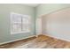 Comfortable room with hardwood floors, ample light from a large window, and a welcoming atmosphere at 230 Forest Meadow Ln, Franklinton, NC 27525