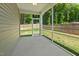 Screened patio with ceiling fan overlooking backyard with trees at 230 Forest Meadow Ln, Franklinton, NC 27525