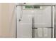 Shower in bathroom with glass sliding doors, silver hardware, and bench at 230 Forest Meadow Ln, Franklinton, NC 27525