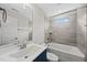 The bathroom showcases a large vanity, a shower-tub combo, and tiled walls at 2407 Miriam Cir, Durham, NC 27704