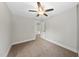 This is a neutral bedroom with carpet flooring and a ceiling fan at 2407 Miriam Cir, Durham, NC 27704