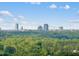 Picturesque view of the city skyline from a distance, surrounded by lush greenery at 2407 Miriam Cir, Durham, NC 27704