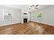 Inviting living room with hardwood floors, white walls, and a decorative fireplace feature at 2407 Miriam Cir, Durham, NC 27704