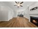 Bright living room with hardwood floors, an open layout, and a decorative fireplace at 2407 Miriam Cir, Durham, NC 27704