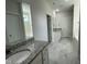 Luxury bathroom showcasing double sinks and a soaking tub at 253 Busterfield Ct, Benson, NC 27504
