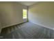 Bedroom with plush gray carpet, one window, and neutral walls at 253 Busterfield Ct, Benson, NC 27504