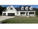 Inviting curb appeal with stone accents and a well-maintained lawn at 253 Busterfield Ct, Benson, NC 27504
