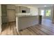 Modern kitchen featuring grey cabinets, granite countertops, and stainless appliances at 253 Busterfield Ct, Benson, NC 27504
