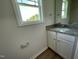 Well-lit bathroom with granite countertops, white cabinets and modern fixtures at 253 Lotus Ave, Smithfield, NC 27577