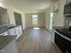Bright kitchen with granite countertops, stainless appliances, and an eat-in area at 253 Lotus Ave, Smithfield, NC 27577