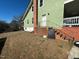 Back view of the home, showing the basement entrance and backyard at 302 N 12Th St, Erwin, NC 28339