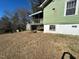 Back exterior view of home and basement entrance plus backyard shed at 302 N 12Th St, Erwin, NC 28339
