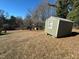Backyard area with outbuilding in the distance at 302 N 12Th St, Erwin, NC 28339