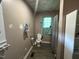 Bathroom with toilet, shower, cabinet, and vinyl flooring at 302 N 12Th St, Erwin, NC 28339
