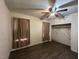 Bedroom with laminate wood flooring, overhead ceiling fan and closet at 302 N 12Th St, Erwin, NC 28339
