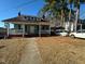 Inviting two-story home featuring a quaint front porch and classic architectural details at 302 N 12Th St, Erwin, NC 28339