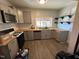 Kitchen with wood countertops, gray cabinets, and stainless steel dishwasher at 302 N 12Th St, Erwin, NC 28339