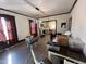 Living room with hardwood floors and view into kitchen at 302 N 12Th St, Erwin, NC 28339