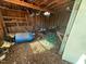 Interior of shed, with blue barrel, green hose and wood framing at 302 N 12Th St, Erwin, NC 28339