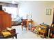 Cozy bedroom featuring a well-lit window, ample desk space, and comfortable furnishings at 3027 Maple Ave # Apt K3, Burlington, NC 27215