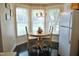 Charming breakfast nook with a table and chairs next to a large window at 3027 Maple Ave # Apt K3, Burlington, NC 27215
