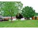 Scenic community with well-maintained lawns, mature trees, and charming residential buildings at 3027 Maple Ave # Apt K3, Burlington, NC 27215