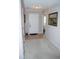 Inviting hallway featuring neutral paint, tile flooring and a carpet runner at 3027 Maple Ave # Apt K3, Burlington, NC 27215
