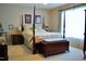 Cozy bedroom with a four-poster bed, carpet flooring and natural light at 3027 Maple Ave # Apt K3, Burlington, NC 27215