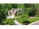 Aerial view of the home showcasing its well-maintained lawn and mature trees at 304 Villa Dr, Durham, NC 27712