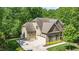 Aerial view of the home with a basketball court and three-car garage at 304 Villa Dr, Durham, NC 27712