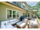 Spacious back deck with outdoor seating, a grill, and beautiful backyard views at 304 Villa Dr, Durham, NC 27712