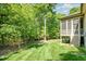 Backyard view with a screened porch and lush greenery at 304 Villa Dr, Durham, NC 27712