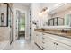 Bathroom vanity with double sinks, and a glass-enclosed walk in shower at 304 Villa Dr, Durham, NC 27712