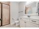 Bathroom with tile shower and floor with a white vanity and framed mirror at 304 Villa Dr, Durham, NC 27712