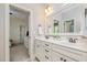 A well-lit bathroom offering double sinks, a large mirror, and plenty of storage at 304 Villa Dr, Durham, NC 27712
