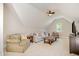A generous bonus room with comfortable seating and a television for entertainment at 304 Villa Dr, Durham, NC 27712