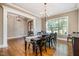 Elegant dining room with hardwood floors, chandelier and large windows at 304 Villa Dr, Durham, NC 27712