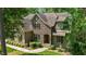 Stunning stone home with manicured lawn and meticulously maintained landscaping at 304 Villa Dr, Durham, NC 27712