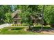Beautiful home with an earthy, split stone and siding exterior plus manicured shrubs at 304 Villa Dr, Durham, NC 27712
