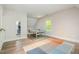 Spacious game room with ping pong table, natural light, and wood flooring at 304 Villa Dr, Durham, NC 27712