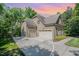 Exterior view of a home featuring a multi-car garage and basketball court at 304 Villa Dr, Durham, NC 27712