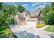 Attached three car garage with additional parking and a basketball hoop at 304 Villa Dr, Durham, NC 27712