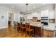 Gourmet kitchen with granite countertops, stainless steel appliances, and breakfast bar at 304 Villa Dr, Durham, NC 27712