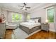 Bright main bedroom featuring hardwood floors, tray ceilings and natural light at 304 Villa Dr, Durham, NC 27712