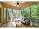 Relaxing screened-in porch with comfortable seating and wooded views at 304 Villa Dr, Durham, NC 27712