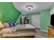 Bright bedroom featuring green walls, a comfortable queen-size bed, and a spacious closet at 3312 Hawk Ridge Rd, Chapel Hill, NC 27516