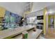 Bright kitchen with white cabinetry, modern appliances, and a breakfast bar at 3312 Hawk Ridge Rd, Chapel Hill, NC 27516